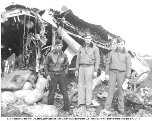 Broussard Alexander Kirkwood in front of wreckage
